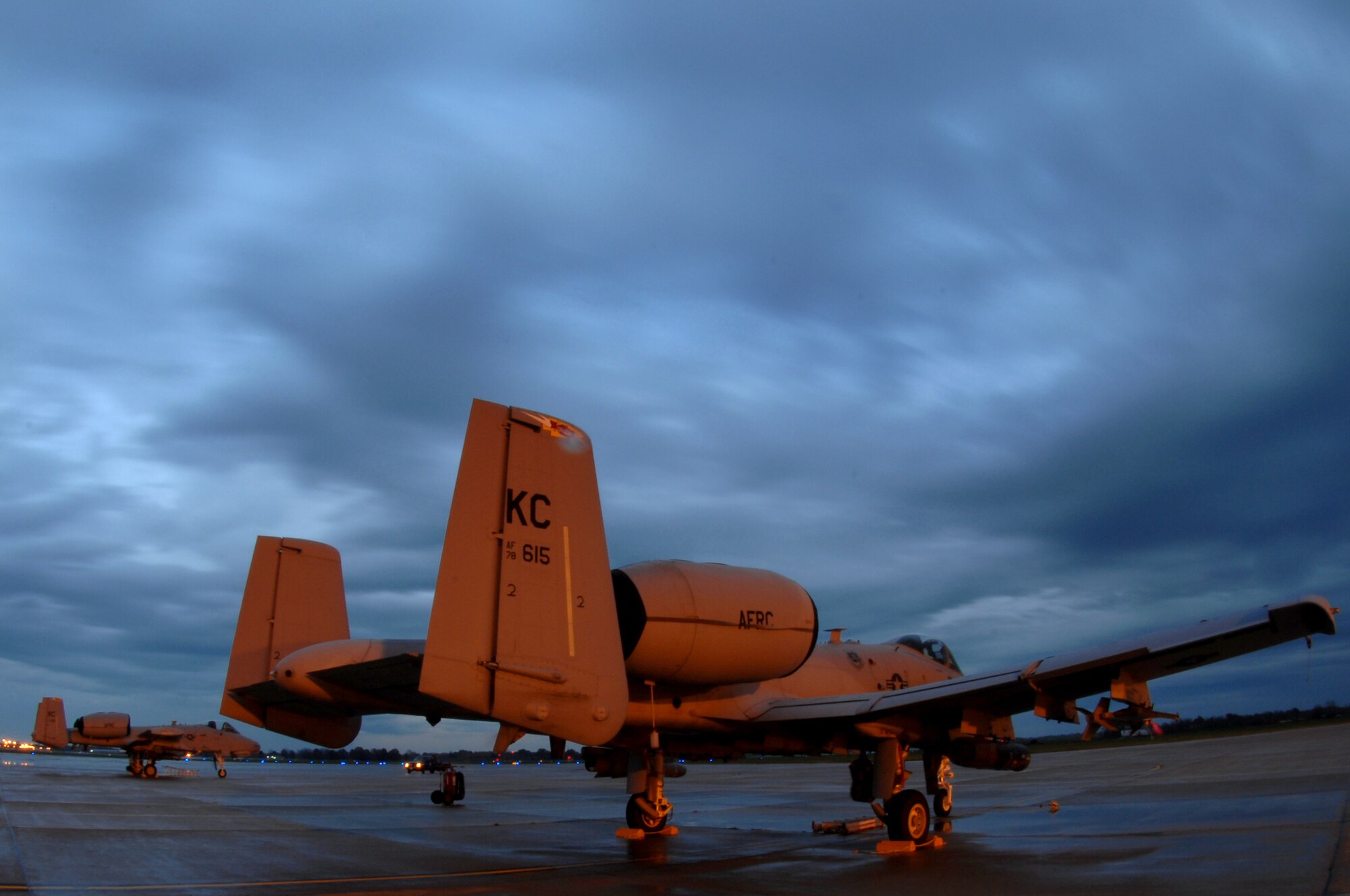 WHITEMAN AIR FORCE BASE, Mo. ? Clouds race over the 442nd Fighter Wing's A-10 Thunderbolt II?s during the early hours of the morning Oct. 29. The 442nd FW maintains a vast fleet of 27 A-10's. The A-10 is designed to provide close air support for ground forces by attacking tanks, armored vehicles, and other ground targets with a limited air interdiction capability. (U.S. Air Force photo/Senior Airman Kenny Holston)(Released)