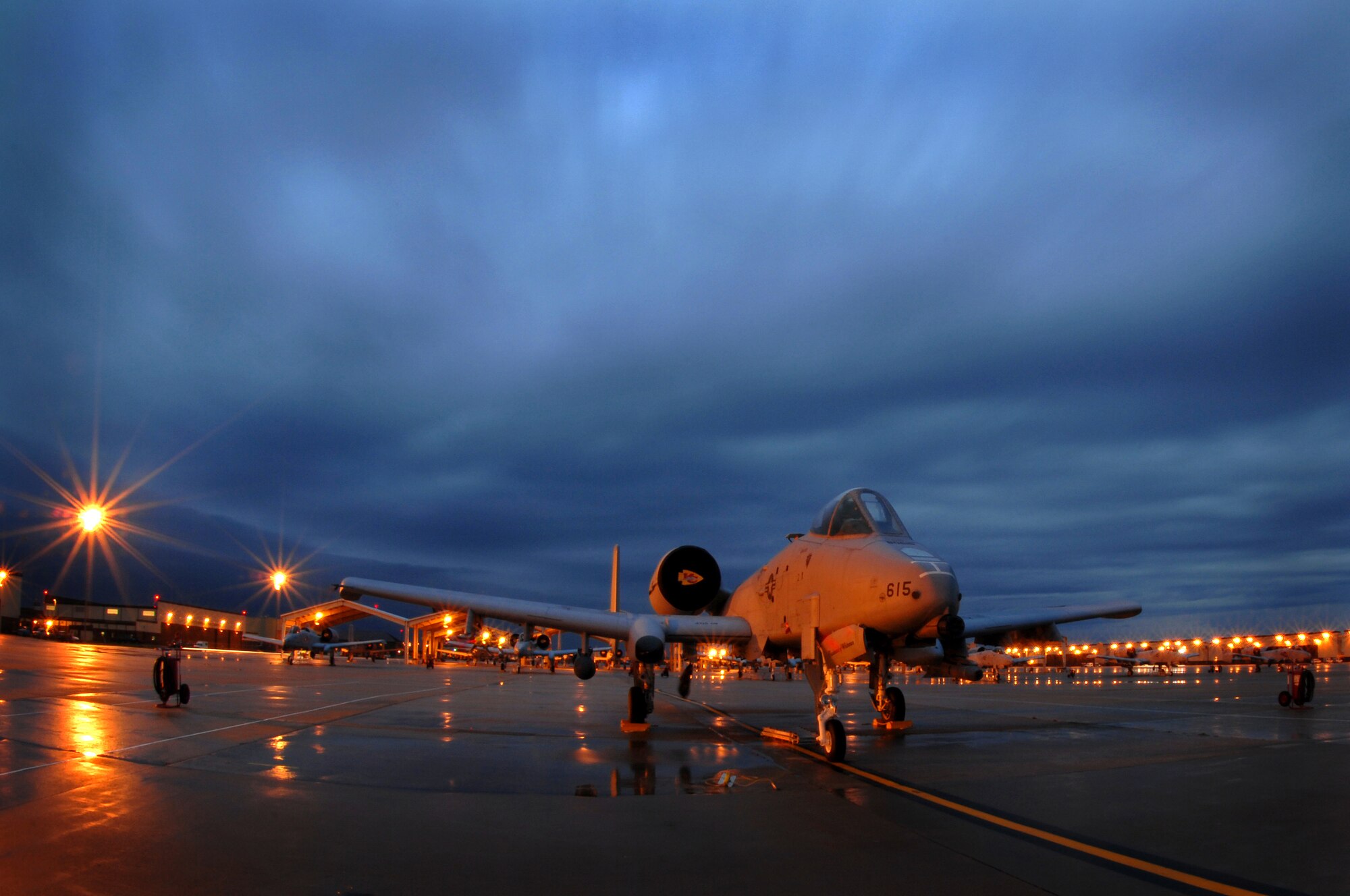 WHITEMAN AIR FORCE BASE, Mo. ? Clouds race over the 442nd Fighter Wing's A-10 Thunderbolt II?s during the early hours of the morning Oct. 29. The 442nd FW maintains a vast fleet of 27 A-10's. The A-10 is designed to provide close air support for ground forces by attacking tanks, armored vehicles, and other ground targets with a limited air interdiction capability. (U.S. Air Force photo/Senior Airman Kenny Holston)(Released)