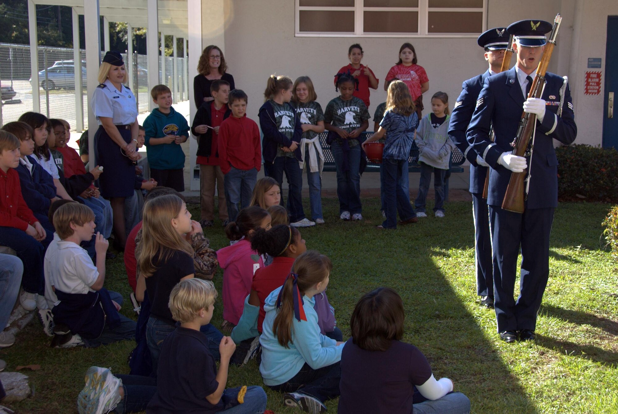 325th Fighter Wing Honor Guard demonstrates rifle maneuvers that are used for flag ceremonies during a recent visit to Lynn Haven Elementary.  Students learned proper American flag etiquette and how to raise and lower the flag. (U.S. Air Force photo by: Lt. Col. Malcolm Kemeny)

