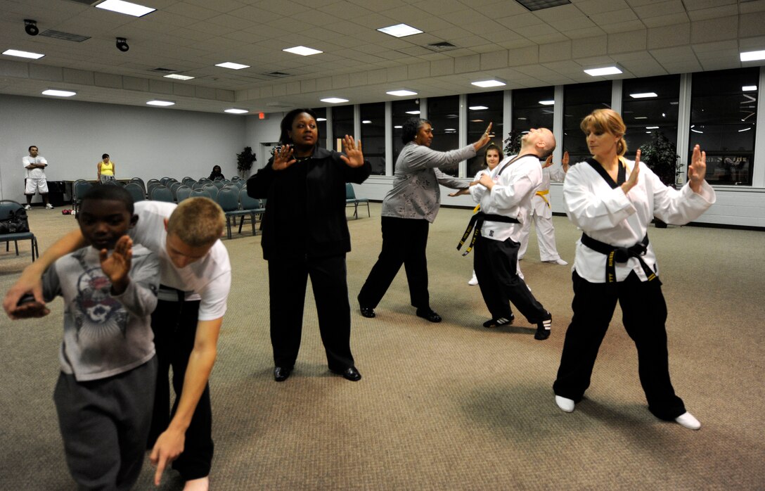 LANGLEY AIR FORCE BASE, Va. - Team Langley members learn basic self-defense tactics, during the Family Self-Defense Class Nov. 3. Taught by International Combat Hapikdo Federation black belts, the class is one of many events held during Military Family Week, Nov. 1-7. (U.S. Air Force photo/Senior Airman Dana Hill)