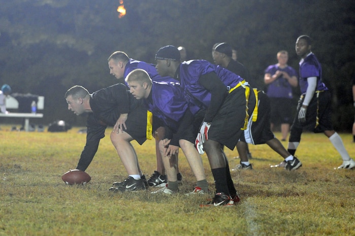 Members of the 437th Security Forces Squadron intramural flag football team line up on the line of scrimmage during a game against the Coast Guard here Nov. 3. The 437 SFS defeated the Coast Guard 20-6. (U.S. Air Force photo/Staff Sgt. Marie Brown)