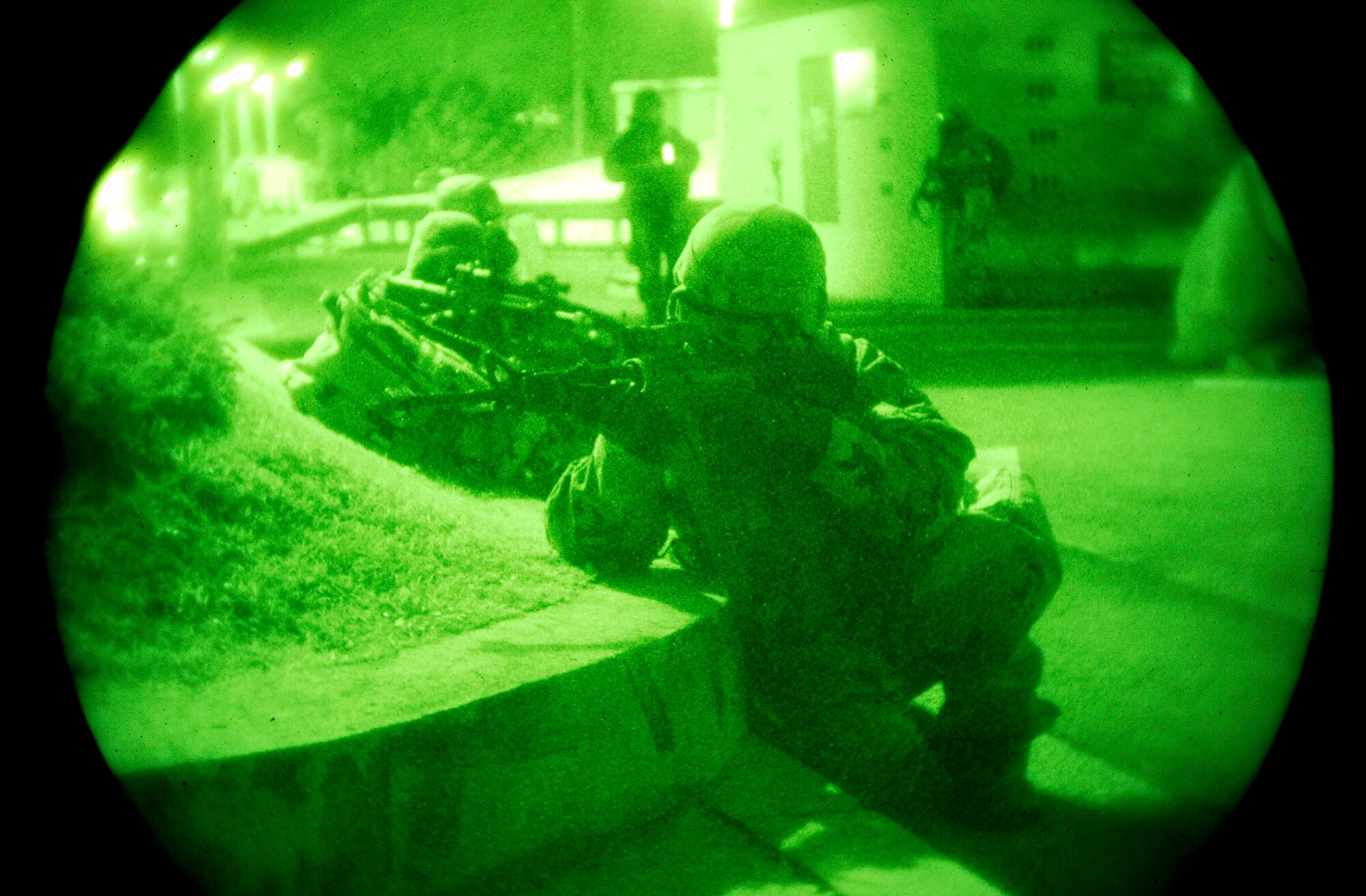 Airmen from the 51st Security Forces Squadron fight off "opposing forces" during a night training exercise Nov. 3, 2009, Osan Air Base, South Korea. (U.S. Air Force photo/Staff Sgt. Brian Ferguson)