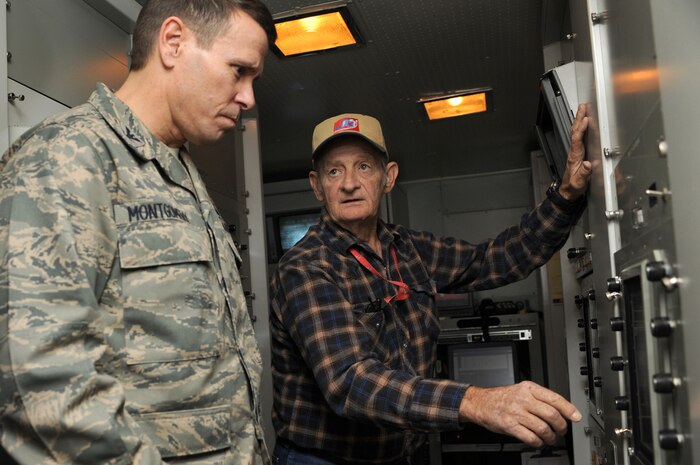 NEVADA TEST and TRAINING RANGE, Nev. -- Col. John Montgomery 98th Range Wing commander and Dave Leake, a NTTR threat system operator, discuss the operations of the SA-2 threat system simulator at the Tolicha Peak Electronic Combat Range Oct. 26. The Nevada Test and Training Range accounts for 2.9 million acres of land and 12,000 square miles of airspace in Nev.
(U.S. Air Force photo by Tech. Sgt. Michael R. Holzworth)