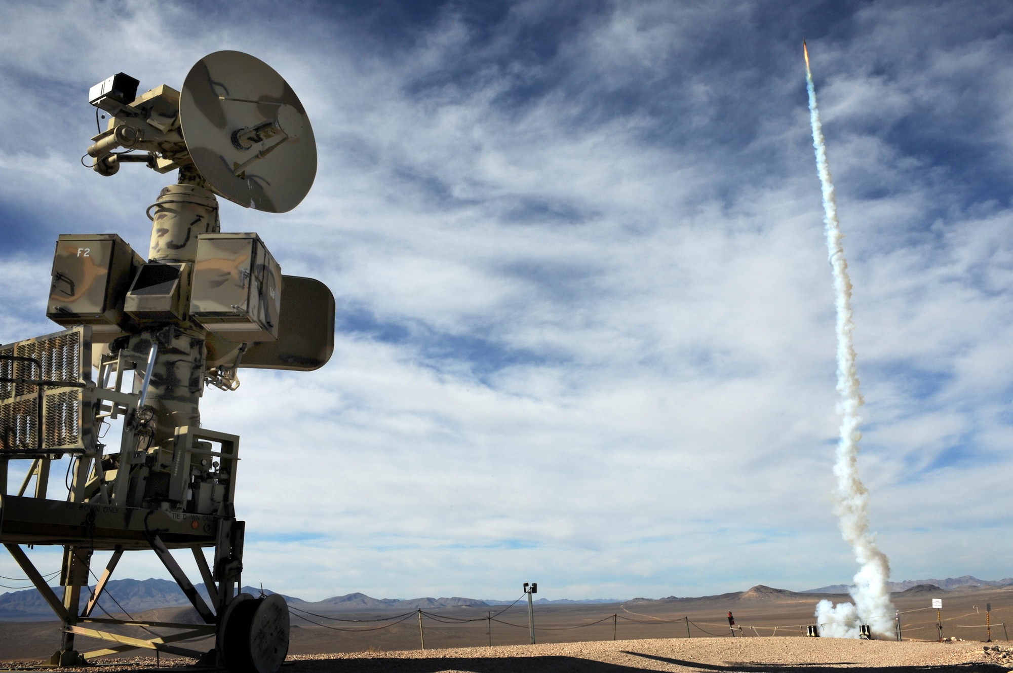 NEVADA TEST and TRAINING RANGE, Nev. -- A"Smokie SAM" simulated surface to air missile launches from a SA-6 threat system simulator at the Tolicha Peak Electronic Combat Range Oct. 26.  The small rockets are fired in the air when a threat system operator has locked on to a target.  The simulate surface to air missile give pilots a visual simulation during training on the Nevada Test and Training Range.
(U.S. Air Force photo by Tech. Sgt. Michael R. Holzworth)