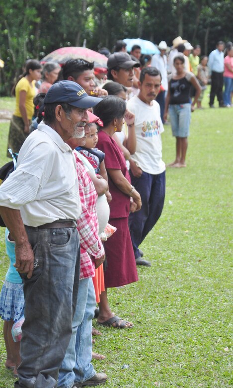 SOTO CANO AIR BASE, Honduras – Villagers of El Ciruelo, a remote mountain village near Comayagua, Honduras, form a line to recieve food Oct 31 for a monthly chapel hike. Eighty-one volunteers from Joint Task Force-Bravo hiked more than five miles up and down a rocky, mountain road to deliver food to the remote village. The volunteers carried a total of 122 bags of food, equaling 2,684 pounds. Each bag of food was intended to go to one of the families of this poor mountain village, and included vegetable oil, ketchup, pasta, a couple cans of sardines and bags of sugar, rice, flour and beans (U.S. Air Force photo/Staff Sgt. Chad Thompson).