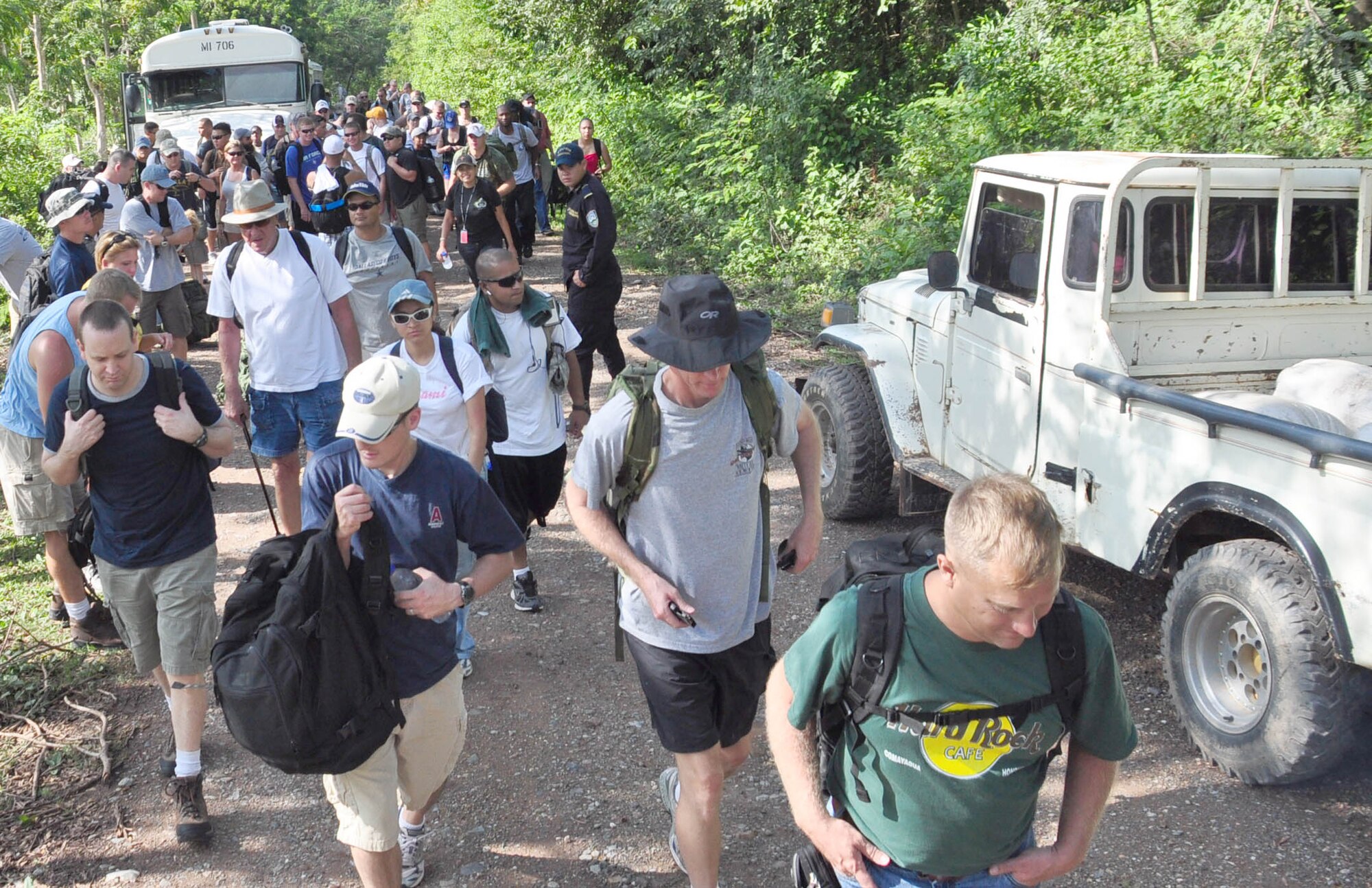 SOTO CANO AIR BASE, Honduras – Volunteers gather together on a mountain road near Comayagua, Honduras Oct. 31 for a monthly chapel hike. Eighty-one volunteers from Joint Task Force-Bravo hiked more than five miles up and down a rocky, mountain road just outside of Comayagua, Honduras to deliver food to a remote village. The volunteers carried a total of 122 bags of food, equaling 2,684 pounds. Each bag of food was intended to go to one of the families of this poor mountain village, and included vegetable oil, ketchup, pasta, a couple cans of sardines and bags of sugar, rice, flour and beans (U.S. Air Force photo/Staff Sgt. Chad Thompson).