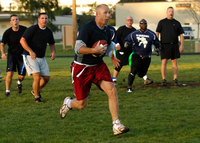 VANDENBERG AIR FORCE BASE, Calif. -- After realizing he had no players open to throw to, quarterback Shane Gwaltney, of the 30th Launch Group, decides to run the football down-field hoping to gain a few extra yards here Thursday, Oct. 29, 2009. Vandenberg has 15 teams that play twice a week. (U.S. Air Force photo/Airman 1st Class Heather R. Shaw)