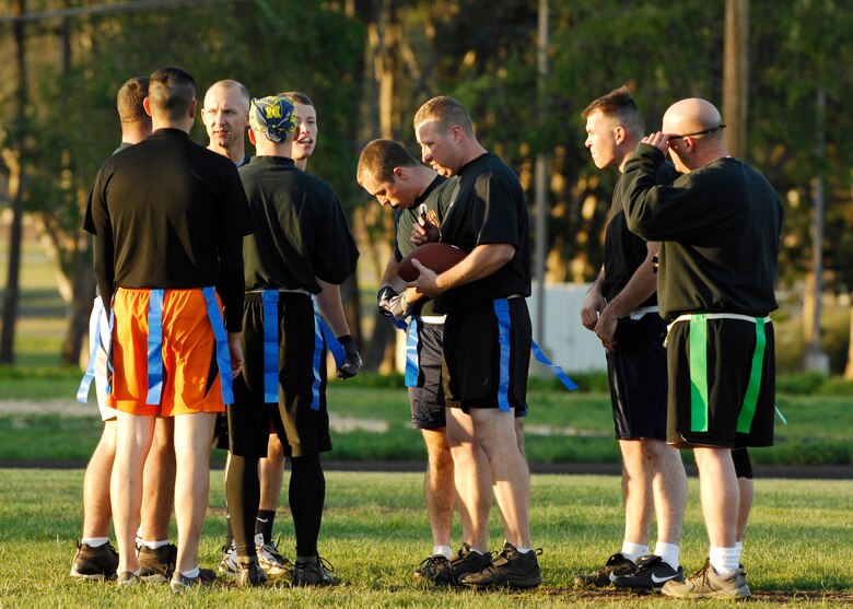 VANDENBERG AIR FORCE BASE, Calif. -- Members of the 30th Launch Group team, huddle to plan their next play during a flag football game against the 392nd Training Squadron's team here Thursday, Oct. 29, 2009. Unfortunately, the 30th LG didn't execute enough as the 392nd TRS won the game 8-0. (U.S. Air Force photo/Airman 1st Class Heather R. Shaw)
