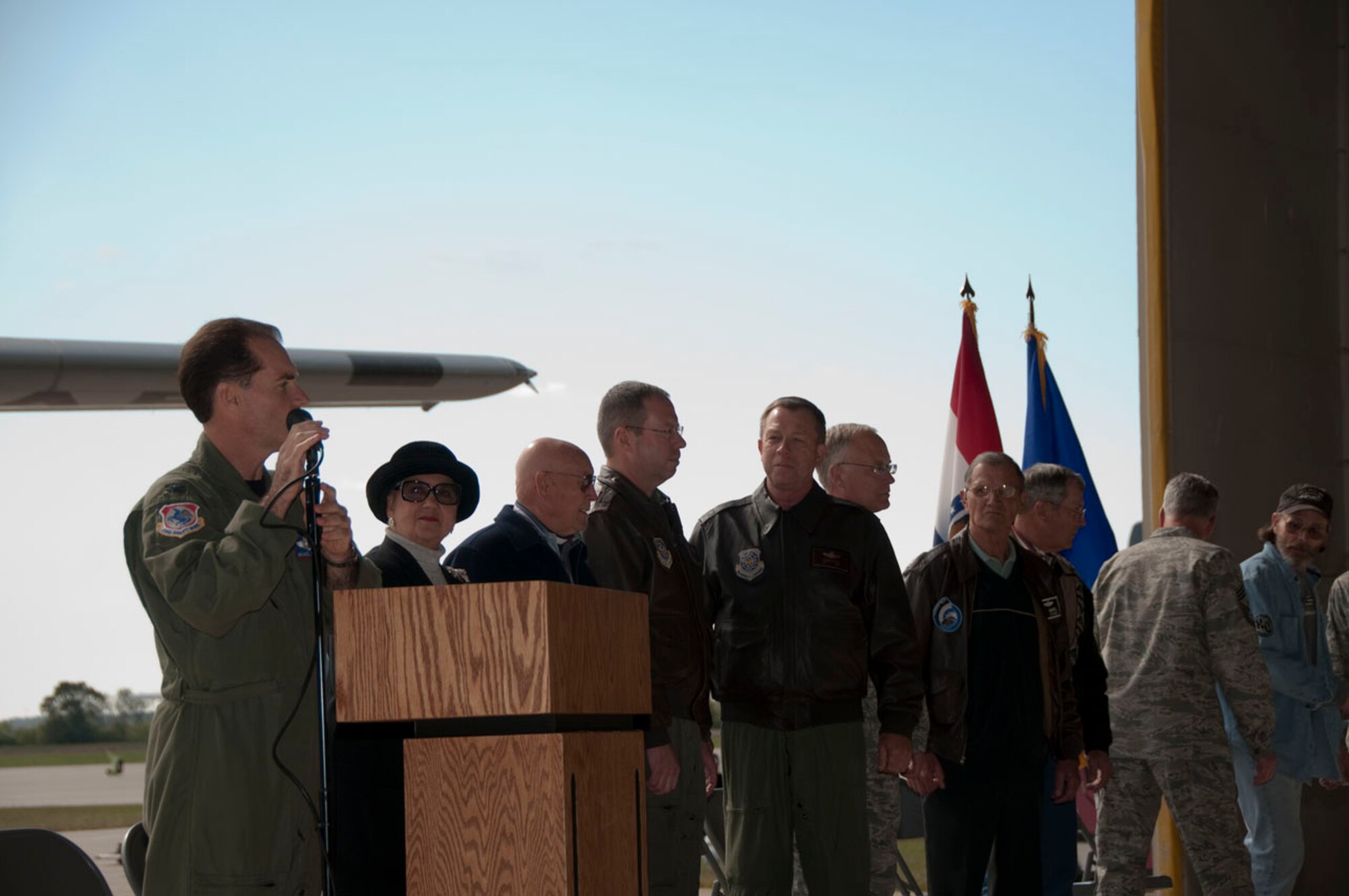 Col. Mike McEnulty, 139th Airlift Wing commander, introduces distinguished guests at the aircraft departure ceremony. Distinguished guests include; former 6th district representative Pat Danner-Meyer, Markt Meyer (former 180th pilot), Brig. Gen. John Owen, Brig. Gen. Stephen Cotter, Col. Andy Halter, Col. (RET) Ken Gabriel, Col. (RET) Gene Davenport.  Not shown; Senior Master Sgt. (RET) George Roberts (original crew chief for aircraft 1396), A1C Chris Prygron (Newest flight line crew chief).  (U.S. Air Force photo by Airman 1st Class Sheldon Thompson)