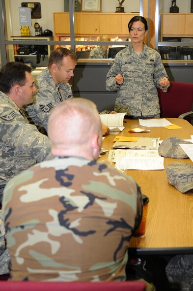 WHITEMAN AIR FORCE BASE, Mo. - Master Sgt. Vicki Miller, 509th Maintenance Operation Squadron NCO in charge of the scheduling element, briefs members of the 509th Maintenance Group on career development course training , Nov. 4. Under the MOS falls the Maintenance Training Flight which is compromised of six hand-selected training managers. They make sure that all 509th Maintenance Group members receive all the formal training necessary to qualify them in skills, knowledge and techniques to maintain and troubleshoot the B-2 Spirit. (U.S. Air Force photo/Airman 1st Class Carlin Leslie) (Released)