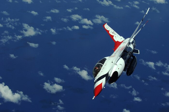 Maj. Tony Mulhare, Thunderbird #8 Advance Pilot/Narrator, flies over the Pacific Ocean on his way to Townsville, Australia where the aerial demonstration squadron will be performing in the upcoming air show on Sept. 26.  (U.S. Air Force photo by Staff Sgt. Kristi Machado)