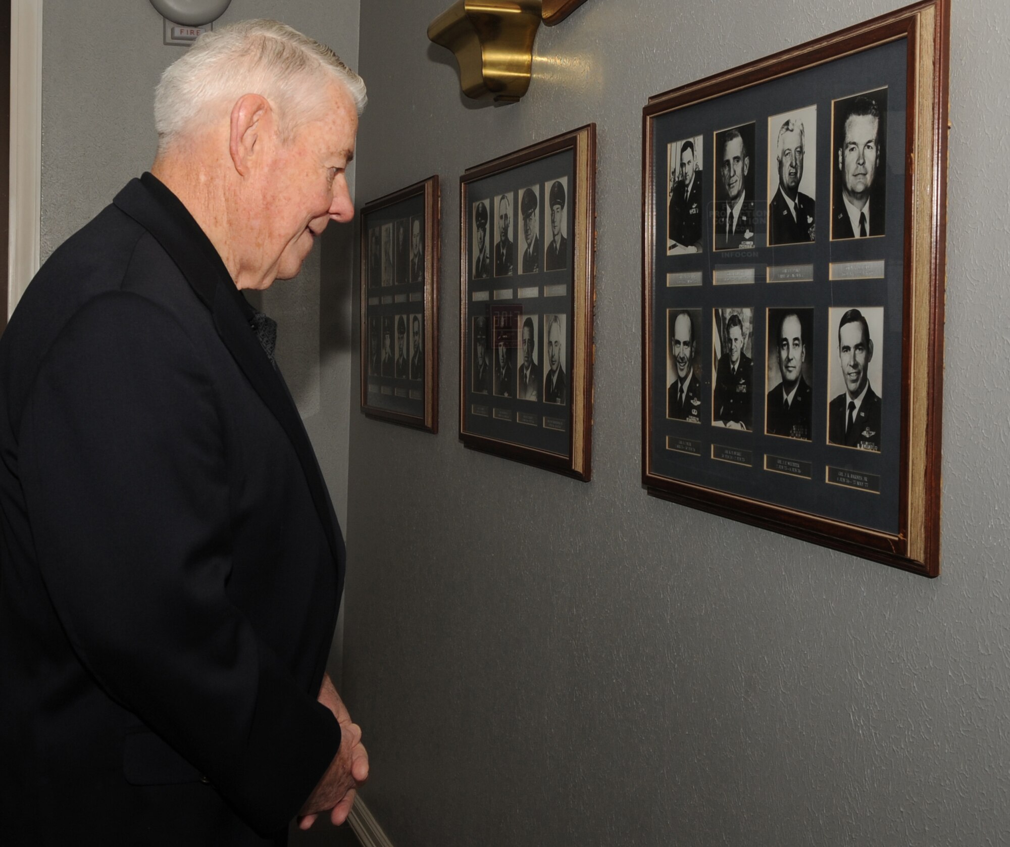 Barksdale AFB, La. - Chief Master Sgt. of the Air Force #5 Robert Gaylor glances at the previous 2d Bomb Wing commanders photos on the wall in the 2d BW headquarters during his visit to Barksdale Oct. 28. (U.S. Air Force photo by Senior Airman Alexandra Longfellow) (RELEASED)