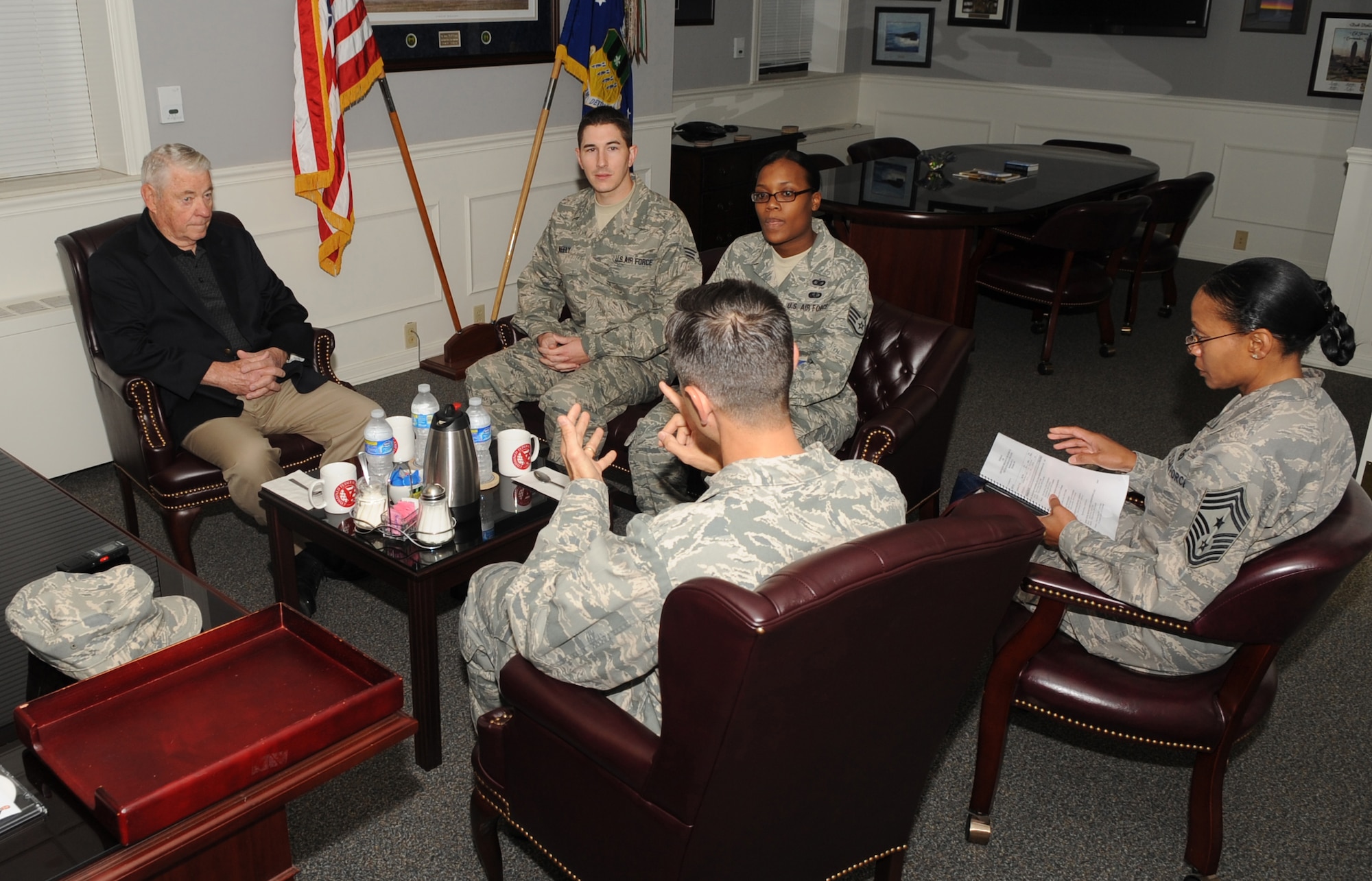 Barksdale AFB, La. - Chief Master Sgt. of the Air Force #5 Robert Gaylor discusses the future of the Air Force with Col. Steven Basham, 2d Bomb Wing commander and Chief Master Sgt. Jo Ann Pace, 2d BW command chief as Staff Sgt. Erica Moore, 2d BW Staff and Senior Airman Joshua Neely, 8th Air Force listen to the perspective of the 5th Chief Master Sgt. of the Air Force Oct. 28. (U.S. Air Force photo by Senior Airman Alexandra Longfellow) (RELEASED)
