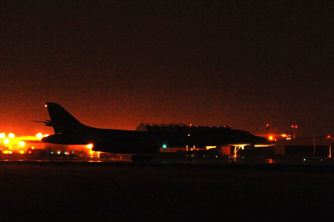 ELLSWORTH AIR FORCE BASE, S.D. -- A B-1B Lancer taxis down the runway after performing a nighttime training mission, Nov 2. The B-1 can deliver massive quantities of precision and nonprecision weapons against any adversary, anywhere in the world. (U.S. Air Force photo/Airman 1st Class Joshua J. Seybert)