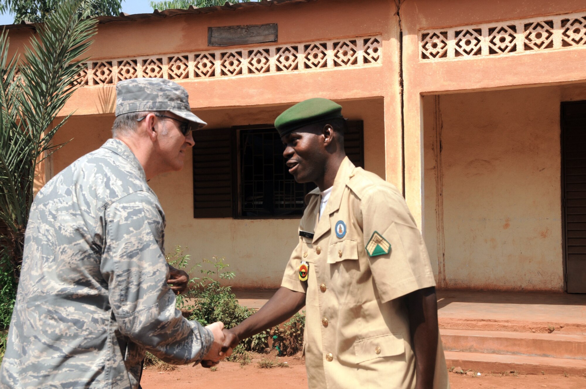 Brig. Gen. Michael W. Callan meets Malian forces Staff Sgt. Niara Diallo during a senior leader engagement Oct. 27, 2009, in Bamako, Mali. General Callan is the 17th Air Force vice commander, and Sergeant Diallo is an English language instructor at the Mali Defense Force English Language Lab. (U.S. Air Force photo/Maj. Paula Kurtz) 