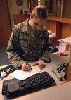 MINOT AIR FORCE BACE, N.D. -- Airman 1st Class Amanda Whittaker, 5th Force Support Squadron guest service representative, updates the guest reservation list at the Sakakawea Inn here, Nov. 3. Updates such as this are an integral part of the Sakakawea Inn’s continuing success in customer service. (U.S. Air Force photo by Senior Airman Michael Veloz)