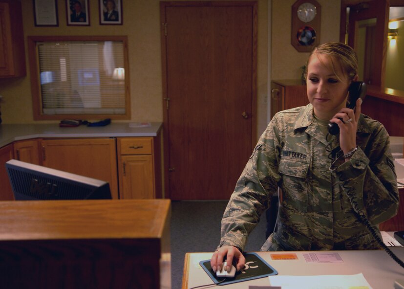 MINOT AIR FORCE BACE, N.D. -- Airman 1st Class Amanda Whittaker, 5th Force Support Squadron guest service representative, reserves a room for an Airman over the phone at the Sakakawea Inn here, Nov. 3. Making reservations such as these is important to ensure a comfortable stay while visiting Minot AFB. (U.S. Air Force photo by Senior Airman Michael Veloz)