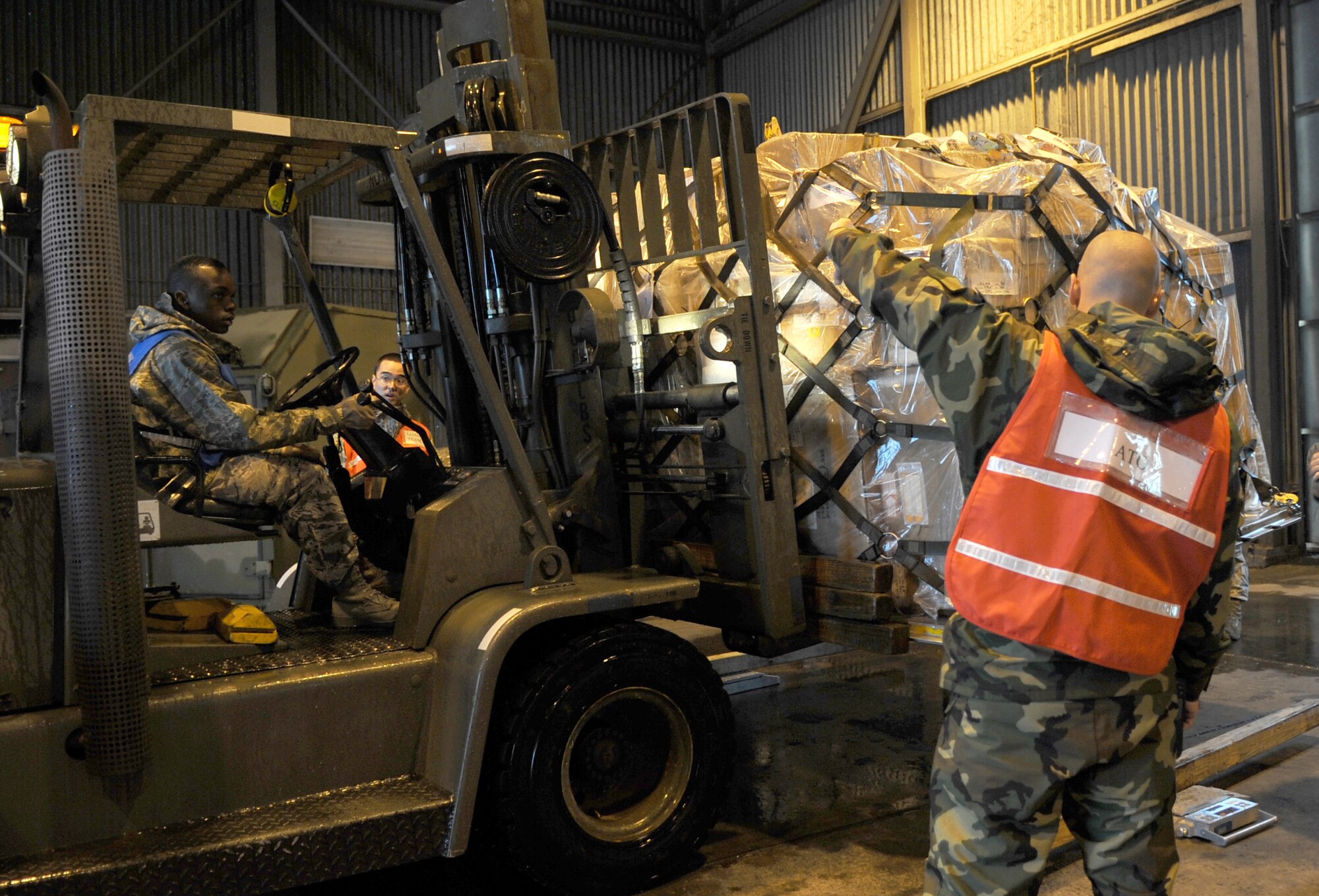 Barksdale AFB, La. - Ready Team Airmen palletize deployers’ baggage and equipment for the deployment to Base X.  The 2d Logistics Readiness Squadron was tasked to process 395 short tons of cargo. (U.S. Air Force photo by Senior Airman Alexandra Longfellow) (RELEASED)