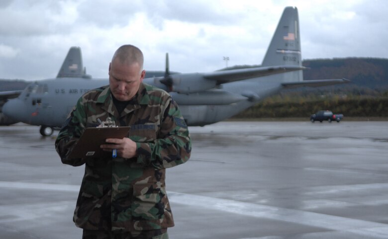 Staff Sgt. Edward Cunningham completes a vehicle checkout form Nov. 4, 2009, Ramstein Air Base, Germany. Sergeants Cunningham is a traditional reservist serving a deployment here with the 38th Expeditionary Airlift Squadron. (U.S. Air Force photo by Tech. Sgt. Michael Voss)