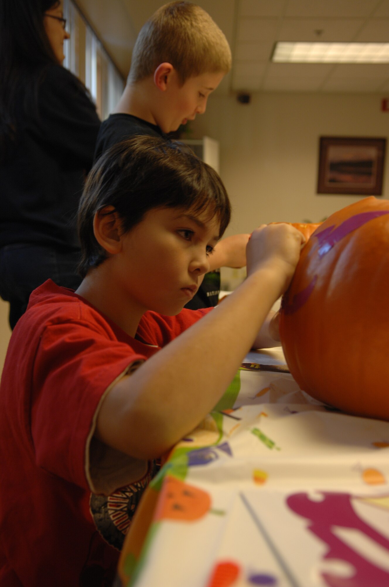 Matthew Smith, son of Master Sgt. Michael Smith, 354th Civil Engineer Squadron, carves a pumpkin during a class at the Airman and Family Readiness Center Oct. 30, 2009, Eielson Air Force Base, Alaska. The pumpkin carving class is one of the many classes that the Airmen and Family Readiness Center offers for Airmen and their families. (U.S. Air Force photo/Airman 1st Class Rachelle Coleman)