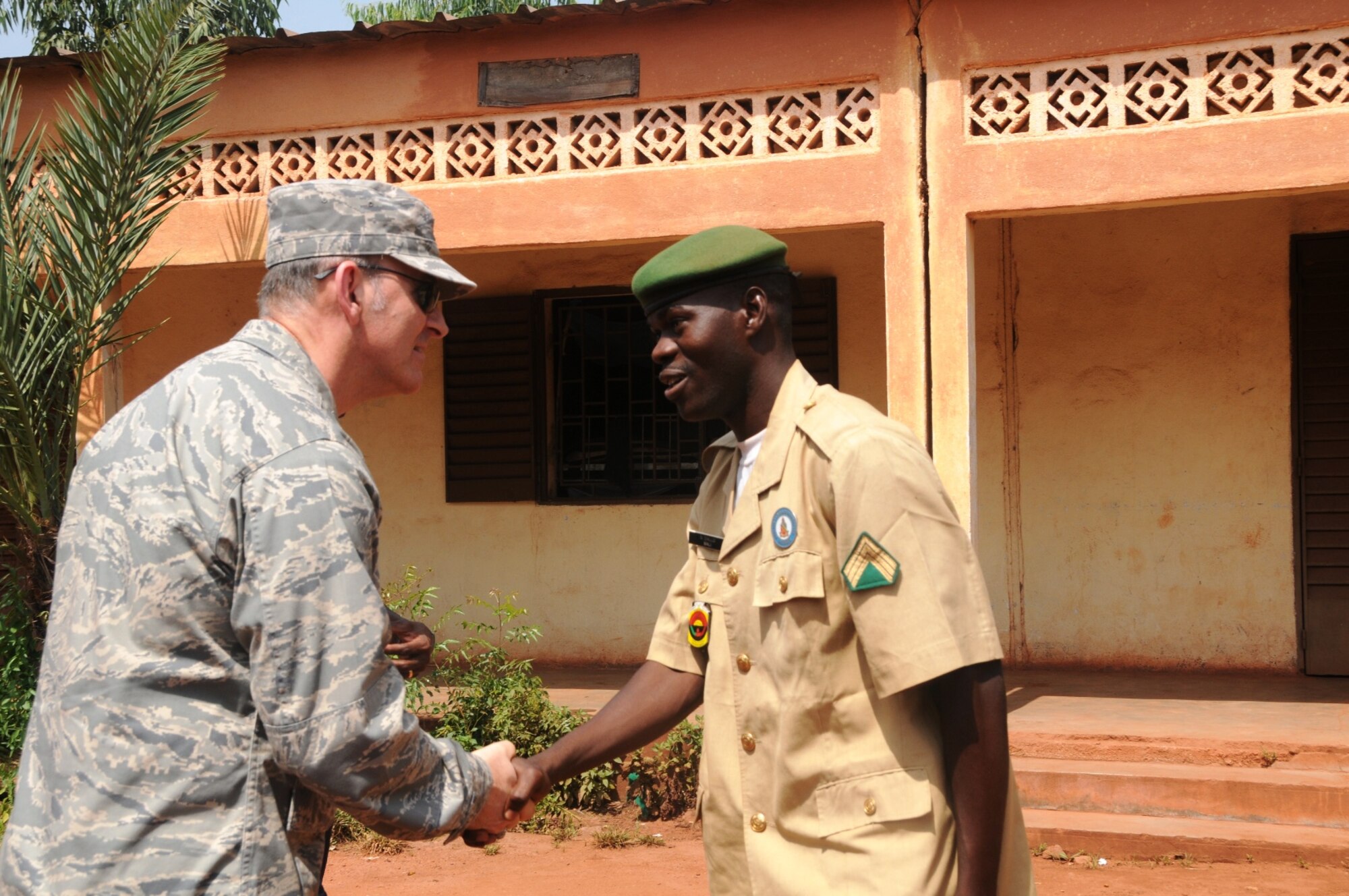 Bamako, Mali -- Staff Sgt. Niara Diallo, English language instructor at the Mali Defense Force English Language Lab, greets Brig. Gen. Mike Callan, 17th Air Force vice commander, during a senior leader engagement in Mali Oct. 27. (USAF photo by Maj. Paula Kurtz)