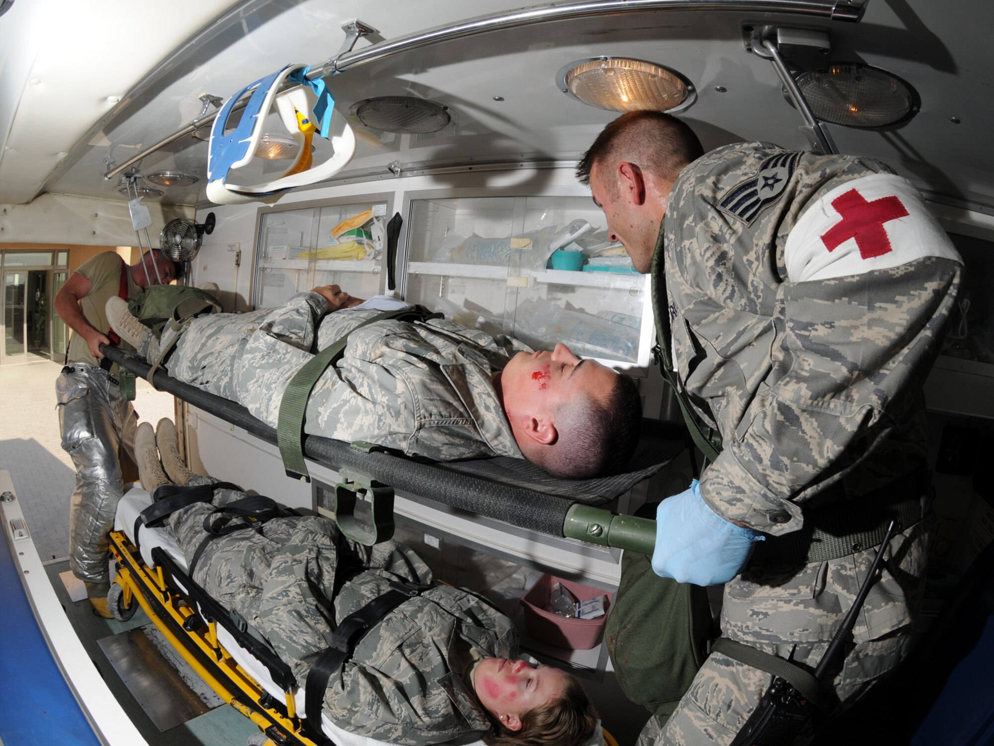 Deployed servicemembers transport simulated casualties during a basewide exercise at an undisclosed location in Southwest Asia, Nov. 3, 2009. Personnel assigned to the 379th Air Expeditionary Wing and other tenant units participate in exercises regularly to train on a variety of potential real-world scenarios. (U.S. Air Force Photo/Tech. Sgt. Jason W. Edwards)