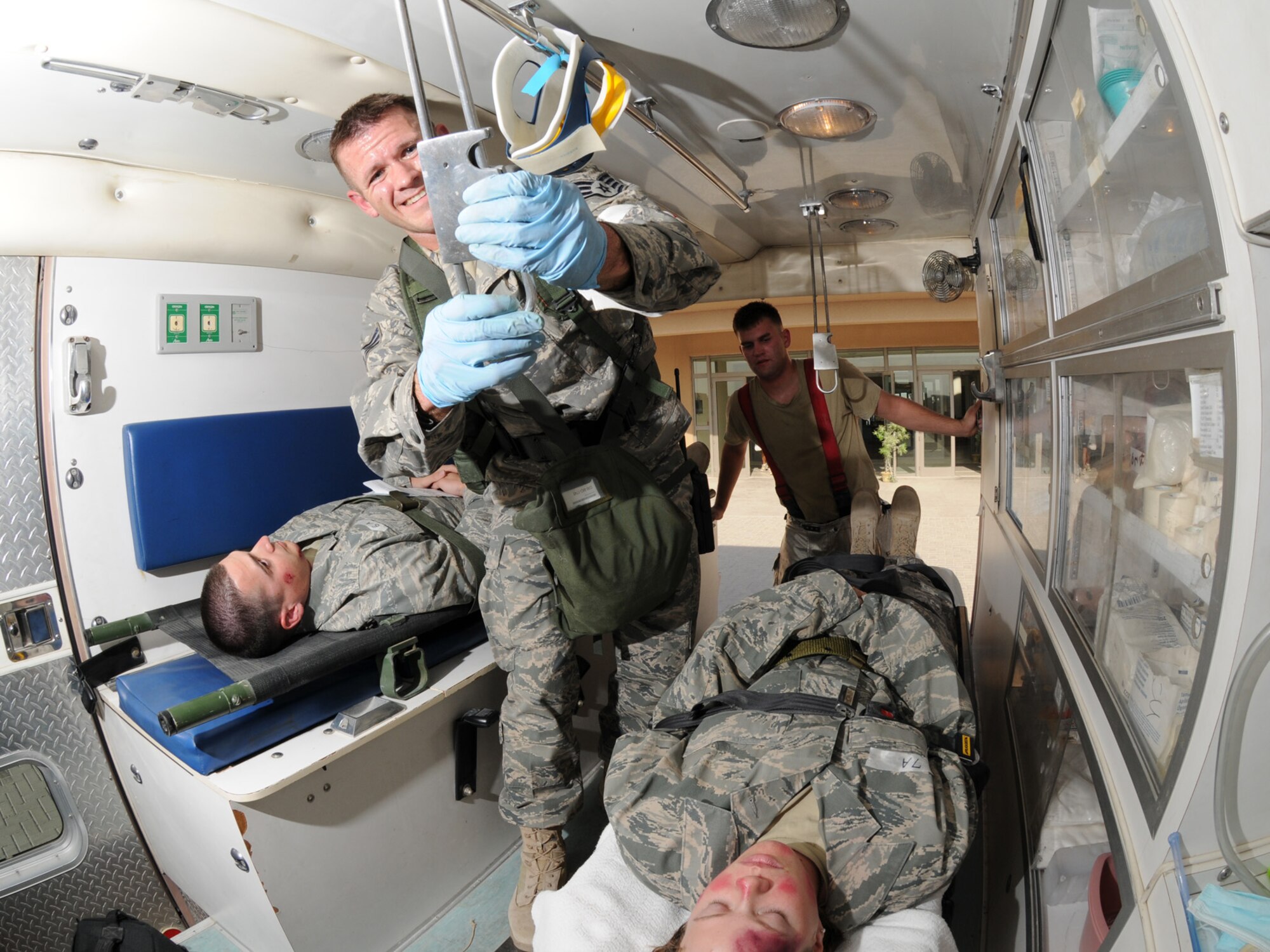 Deployed servicemembers transport simulated casualties during a basewide exercise at an undisclosed location in Southwest Asia, Nov. 3, 2009. Personnel assigned to the 379th Air Expeditionary Wing and other tenant units participate in exercises regularly to train on a variety of potential real-world scenarios. (U.S. Air Force Photo/Tech. Sgt. Jason W. Edwards)