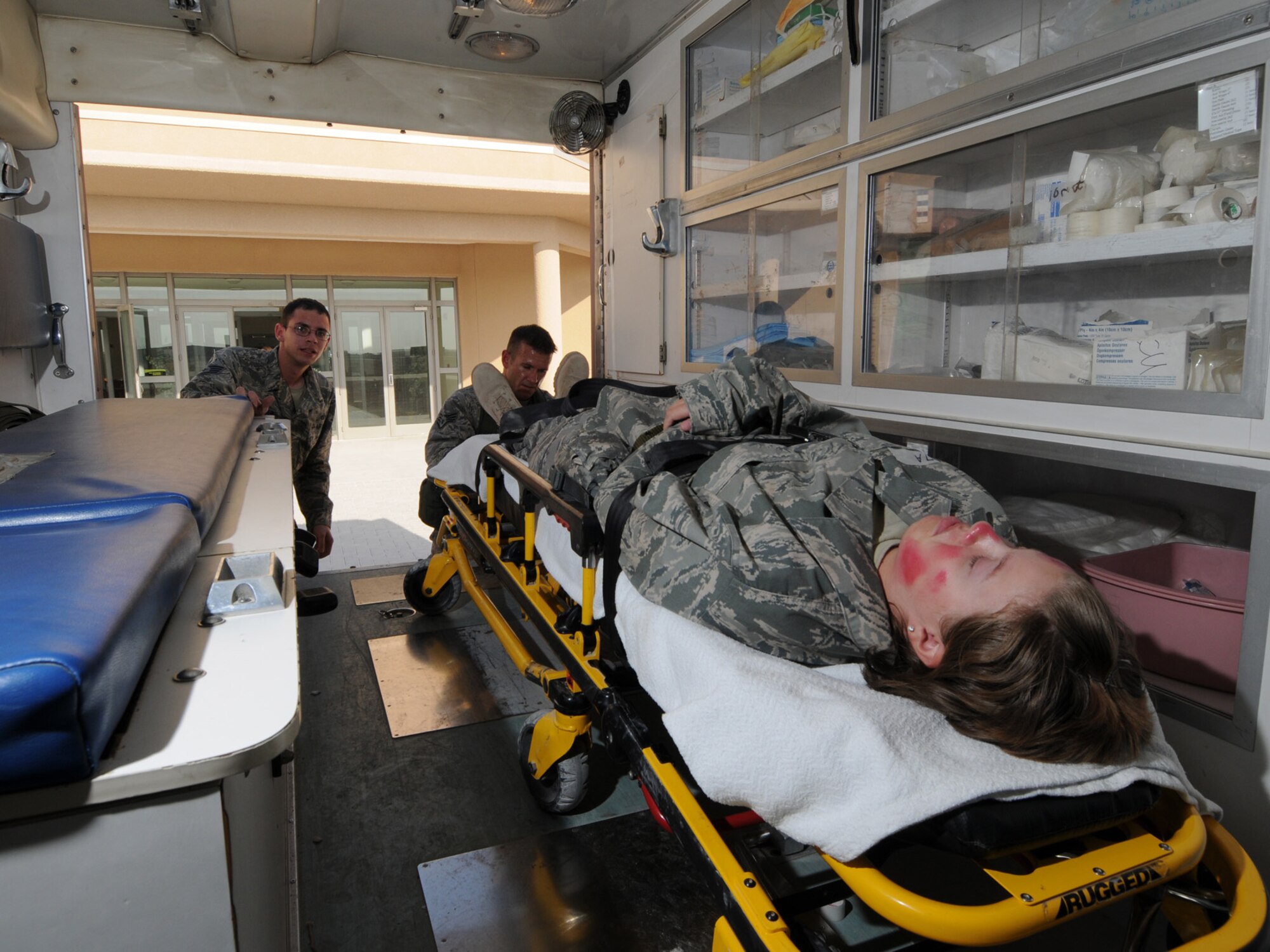 Deployed servicemembers transport a simulated casualty during a basewide exercise at an undisclosed location in Southwest Asia, Nov. 3, 2009. Personnel assigned to the 379th Air Expeditionary Wing and other tenant units participate in exercises regularly to train on a variety of potential real-world scenarios. (U.S. Air Force Photo/Tech. Sgt. Jason W. Edwards)