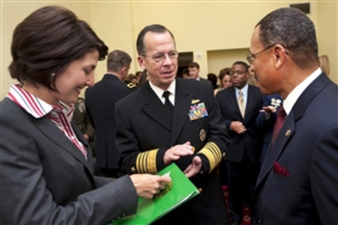 U.S. Navy Adm. Mike Mullen, chairman of the Joint Chiefs of Staff, talks with Congresswoman Cathy McMorris Rodgers, left, and Congressman Sanford Bishop, co-chairs of the Congressional Military Family Caucus at the Rayburn House Office Building, Washington, D.C., Nov. 4, 2009. The caucus will educate congressional members on resources available for military families and help develop legislation to support military families. 