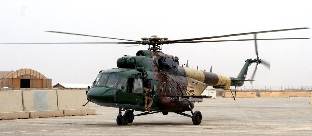 Iraqi Air Force personnel depart after conducting a site survey of the compound at aboard Camp Al Taqaddum, Iraq, Nov. 5 2009. A detachment of 17 personnel from 4th Squadron, Iraqi Air Force, were directed by the Iraqi Ministry of Defense to come to the base, along with their five U.S. Air Force advisors, in order to provide a rotary wing transportation capability to the Anbar Operations Command.  (U.S. Marine Corps photograph by Lance Cpl. Melissa A. Latty)