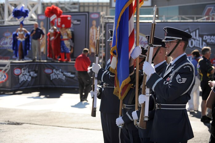 LAS VEGAS -- U.S. Air Force Honor Guard from Nellis Air Force Base stand ready to present the colors during driver introductions before the final round of the National Hot Rod Association Las Vegas Nationals, at the Las Vegas Motor Speedway Nov. 1, 2009.
 (U.S. Air Force photo by Tech. Sgt. Michael R. Holzworth)(released)