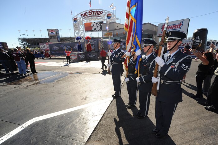 LAS VEGAS -- U.S. Air Force Honor Guard from Nellis Air Force Base stand ready to present the colors during driver introductions before the final round of the National Hot Rod Association Las Vegas Nationals, at the Las Vegas Motor Speedway Nov. 1, 2009.
 (U.S. Air Force photo by Tech. Sgt. Michael R. Holzworth)(released)