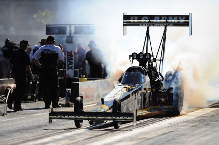 LAS VEGAS -- Tony Schumacher in the U.S. Army Top Fuel Dragster warms up the tires before racing in the second round of Las Vegas Nationals at the Las Vegas Motor Speedway Oct. 31, 2009 Schumacher currently has the 2009 National Hot Rod Association Full Throttle Drag Racing Series points lead
(U.S. Air Force photo by Tech. Sgt. Michael R. Holzworth)(released)