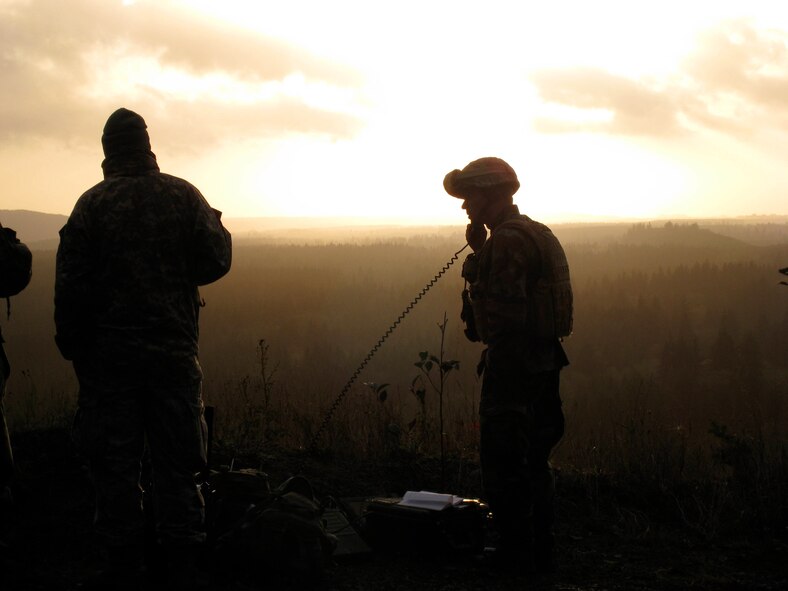 Staff Sgt. Justin Pilant and Senior Airman Andrew Cox, joint terminal attack controllers from the 5th Air Support Operations Squadron at Fort Lewis, Wash., conduct close air support training with F/A-18 Super Hornets flying as part of Exercise Twilight Oct. 22-24. The exercise, which took place in the Olympic Military Operating Area above Forks, Wash., allowed fifteen JTAC Airmen from the 5th ASOS to practice procedures currently used during battlefield operations.  (Courtesy photo) 
