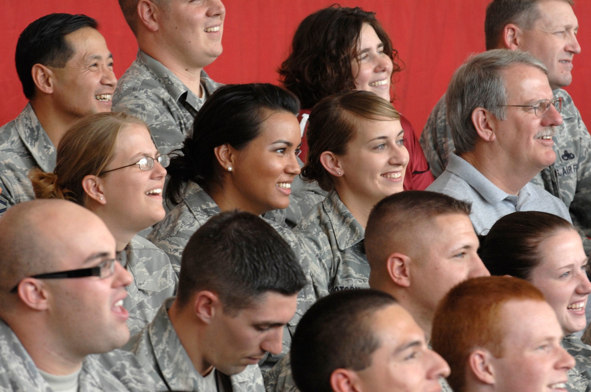 Military members watch the filming of the FOX NFL pregame show with comedian Frank Caliendo in Hanger 999 at the 944th Fighter Wing Nov. 4, 2009, at Luke Air Force Base, Ariz. (U.S. Air Force photo by Staff Sgt. Gary Mathieson)