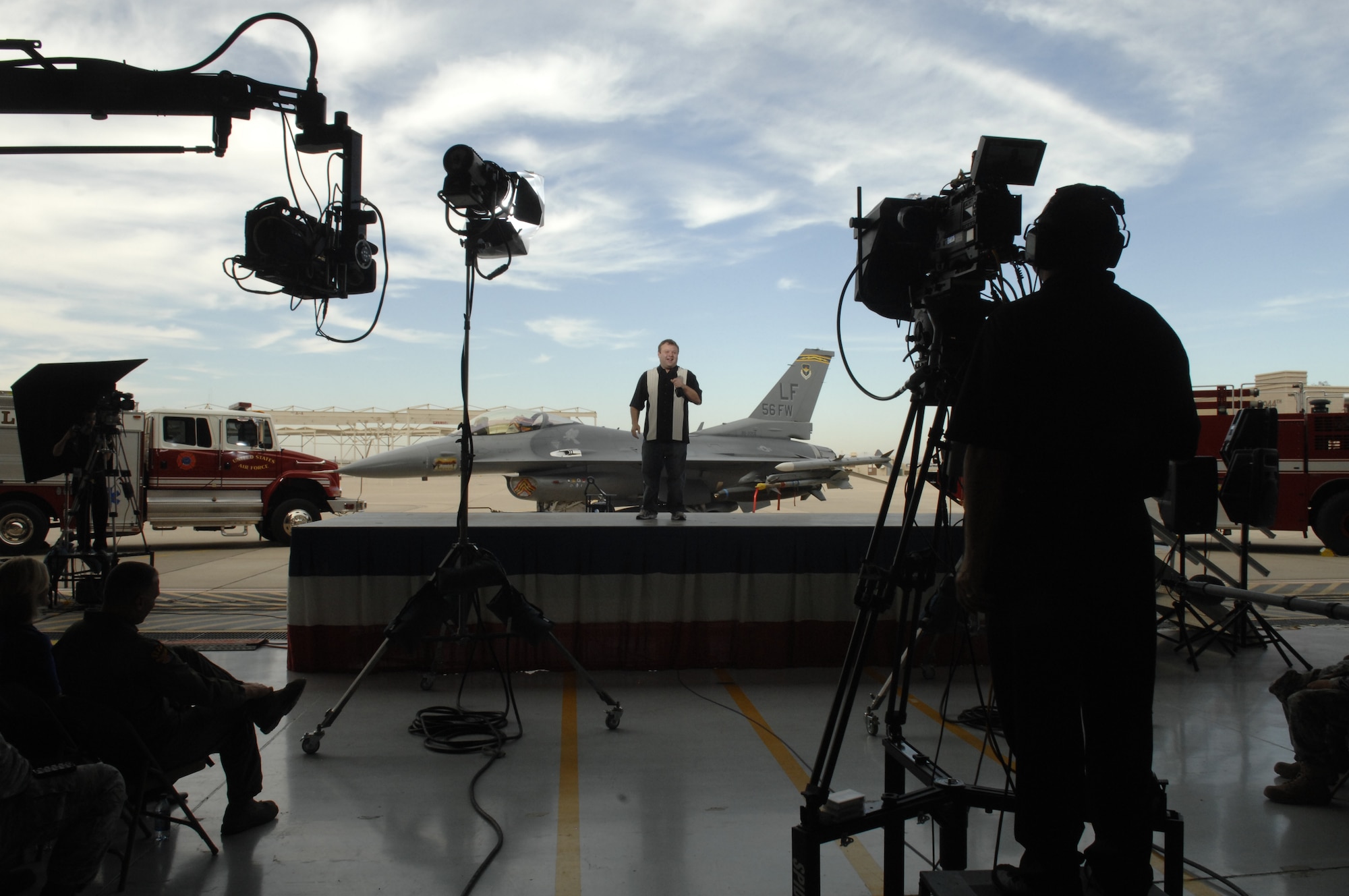 Comedian Frank Caliendo, performs his Fox NFL pregame show, that will air Sunday Nov. 8th, before a military audience, Nov. 4 ,2009, Luke AFB Arizona. (U.S. Air Force photo by Staff Sgt. Gary Mathieson)