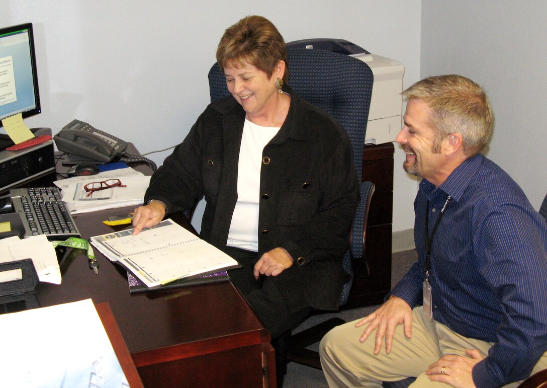 Karen Wilson, coordinator for the new Caring for People pilot program at Nellis Air Force Base, Nev., and Jeffrey McClish, the base's new Recovery Care Coordination Program coordinator, are ramping up programs to support families of deployed military members, and wounded, ill and sick servicemembers, respectively.  (Defense Department photo/Donna Miles)
