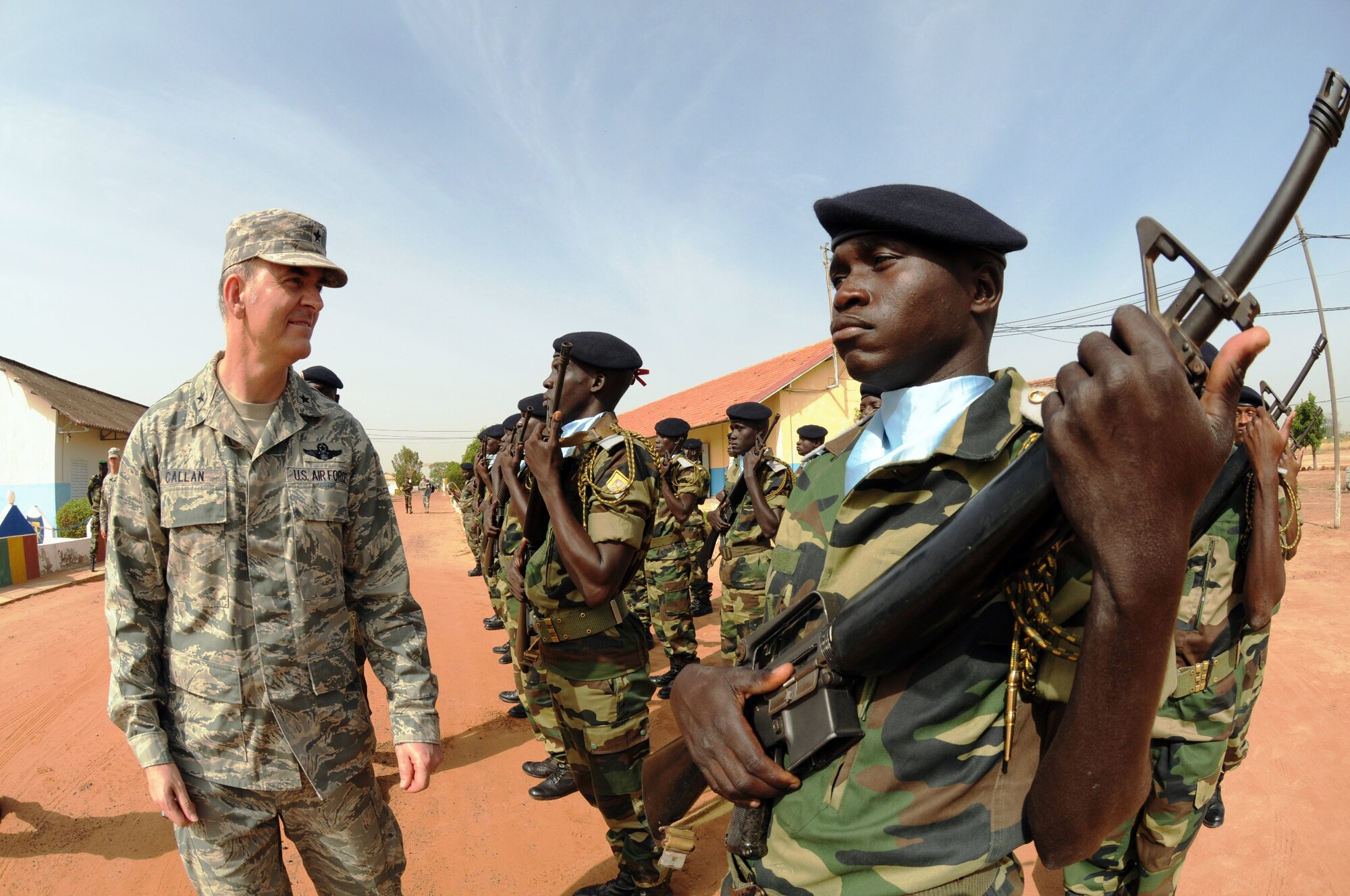 Members of the Senegal army's 3rd Infantry Battalion honor platoon greet Brig. Gen. Michael W. Callan Oct. 30, 2009, at Dakar, Senegal. General Callan served as guest speaker at the graduation ceremony for the first class of Senegal NCO academy instructors. (U.S. Air Force photo/Maj. Paula Kurtz) 