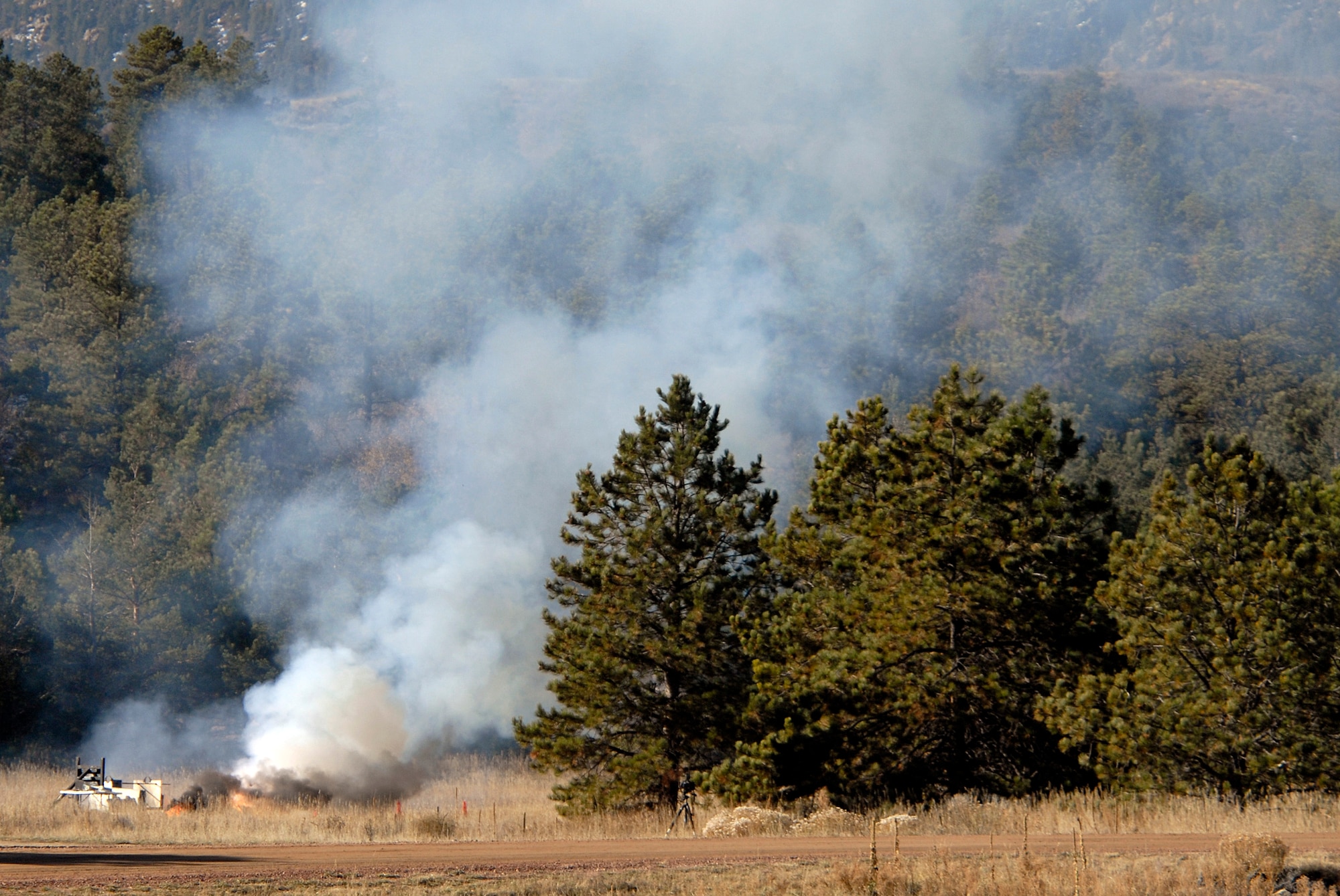 FalconLaunch 6 smolders in Jacks Valley at the U.S. Air Force Academy, Colo., Nov. 4, 2009, after a malfunction caused the rocket to explode during a test firing. Cadets with the FalconLaunch program will investigate to determine the cause of the malfunction. (U.S. Air Force photo/Mike Kaplan)