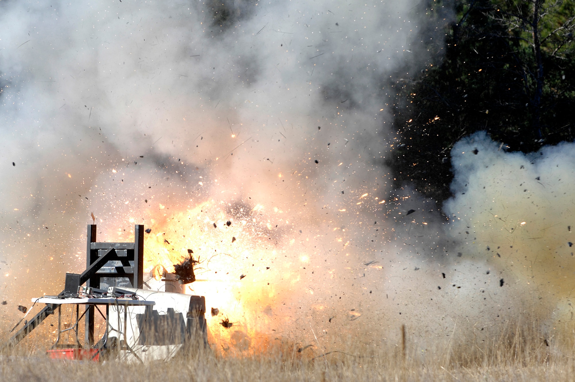 The FalconLaunch 6 rocket static test fire in Jacks Valley at the Air Force Academy, Colo., ended Nov. 4, 2009, as the rocket fired for a fraction of a second and then exploded. The purpose of the static test fire was to validate a new data acquisition system and perform further testing on an igniter design that was developed the previous academic year. (U.S. Air Force photo/Mike Kaplan)