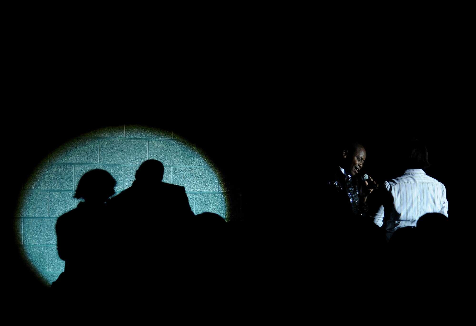 VALDOSTA, Ga. -- Tech. Sgt. Octavious Hill, Tops in Blue vocalist, serenades an audience member during a performance at the Mathis Auditorium here Nov. 4. Performers interact with the audience throughout the hour and a half performance. (U.S. Air Force photo by Senior Airman Gina Chiaverotti-Paige)