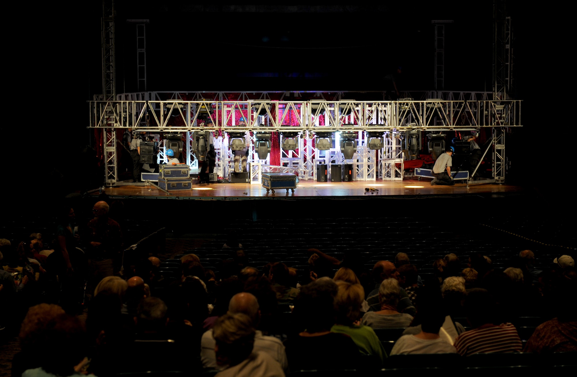 VALDOSTA, Ga. -- Audience members watch as Tops in Blue performers finish building their set at the Mathis Auditorium here Nov. 4. After having vehicle malfunctions, Moody Air Force Base Airmen helped the performers set up the stage in a only a few hours. (U.S. Air Force photo by Senior Airman Gina Chiaverotti-Paige)