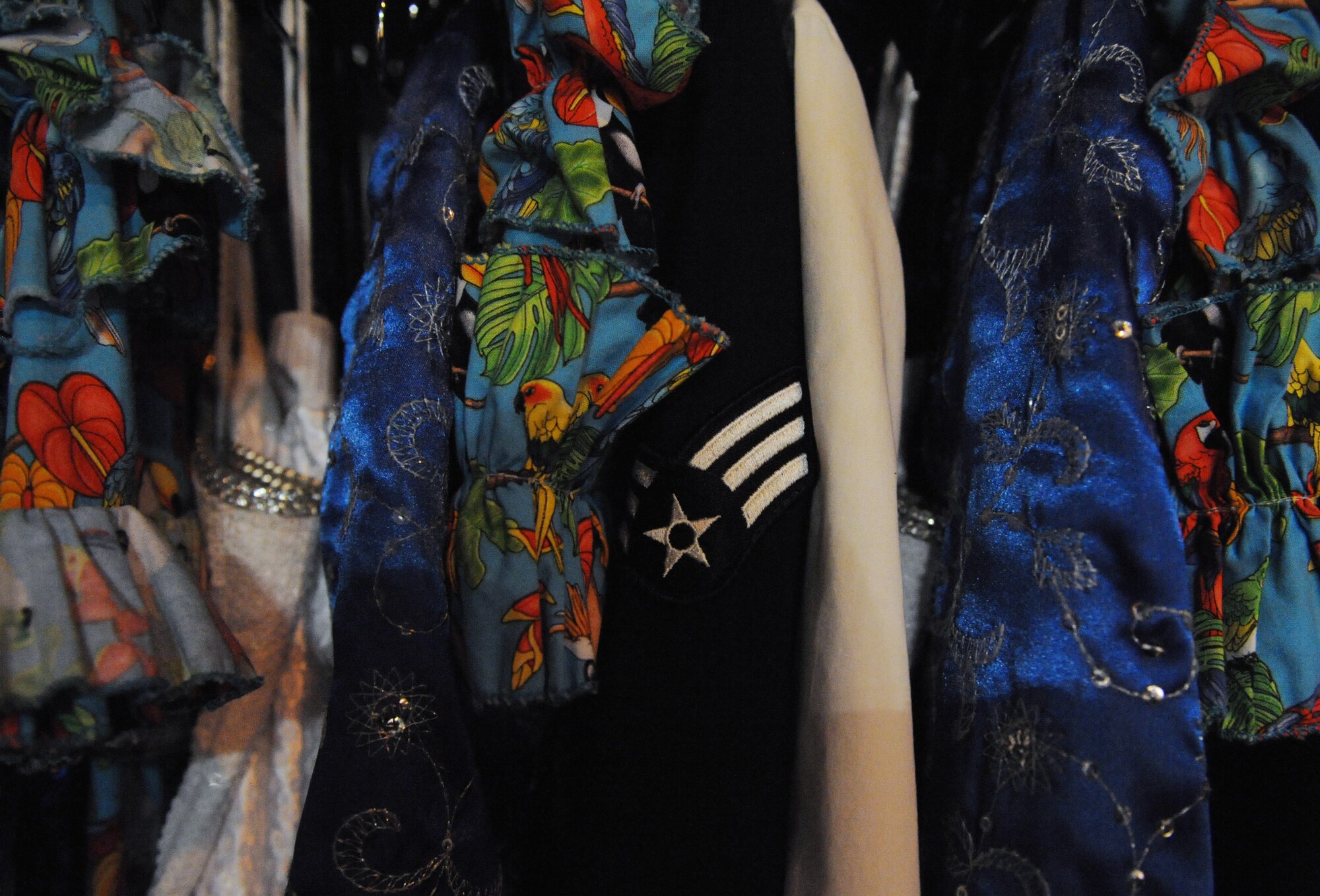 VALDOSTA, Ga. -- Stage outfits and a uniform sit on a rack while Tops in Blue performers build their set before their performance at the Mathis Auditorium here Nov. 4. Outfits are constantly changed for different numbers during the performance. (U.S. Air Force photo by Senior Airman Gina Chiaverotti-Paige)