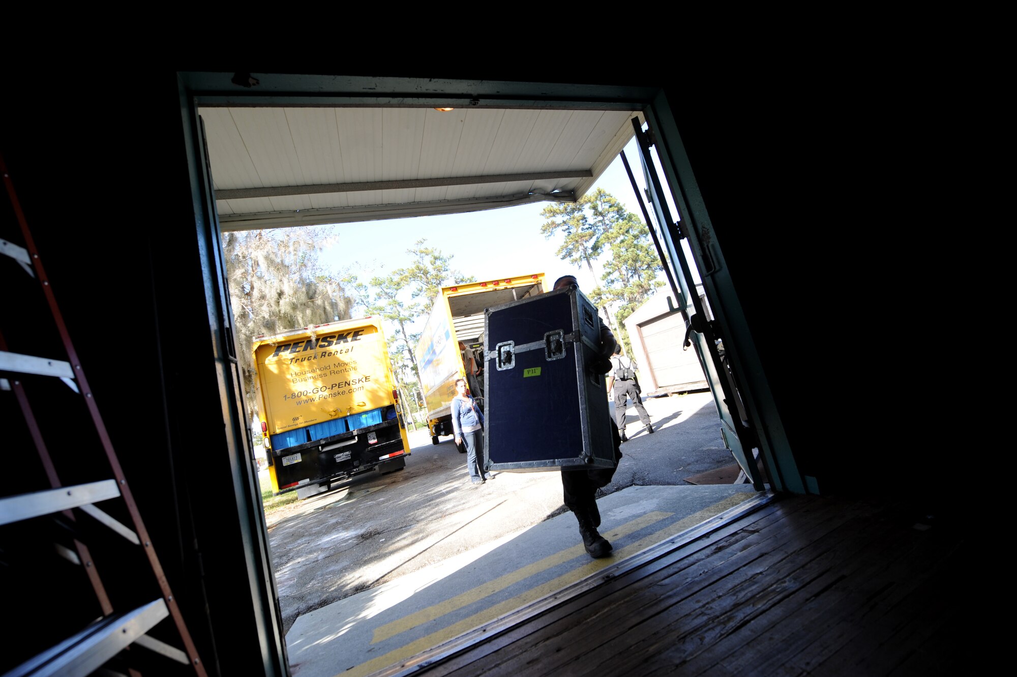 VALDOSTA, Ga. -- A Tops in Blue performer carries a case full of equipment into the Mathis Auditorium here Nov. 4. The team members are not only perform, but also build the set prior to their show. (U.S. Air Force photo by Senior Airman Gina Chiaverotti-Paige)