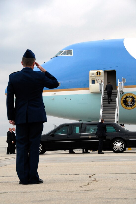 Col. Joe Brandemuehl, commander of the Wisconsin Air National Guard's 115th Fighter Wing, salutes as President Barack Obama boards Air Force One following a visit to Madison's Wright Middle School  Nov. 4. (Wisconsin National Guard photo by Sgt. 1st Class Vaughn R. Larson)