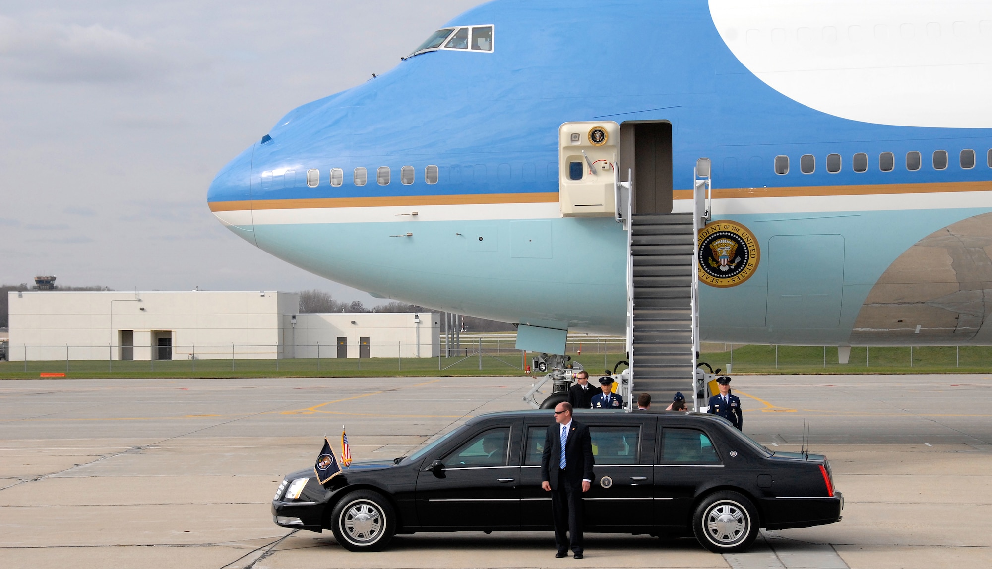 The presidential limousine carrying President Barack Obama pulls next to Air Force One as the president's visit to Madison draws to a close Nov. 4. The president visited the Wisconsin Air National Guard's 115th Fighter Wing en route to Madison's Wright Middle School. (Wisconsin National Guard photo by Sgt. 1st Class Vaughn R. Larson)