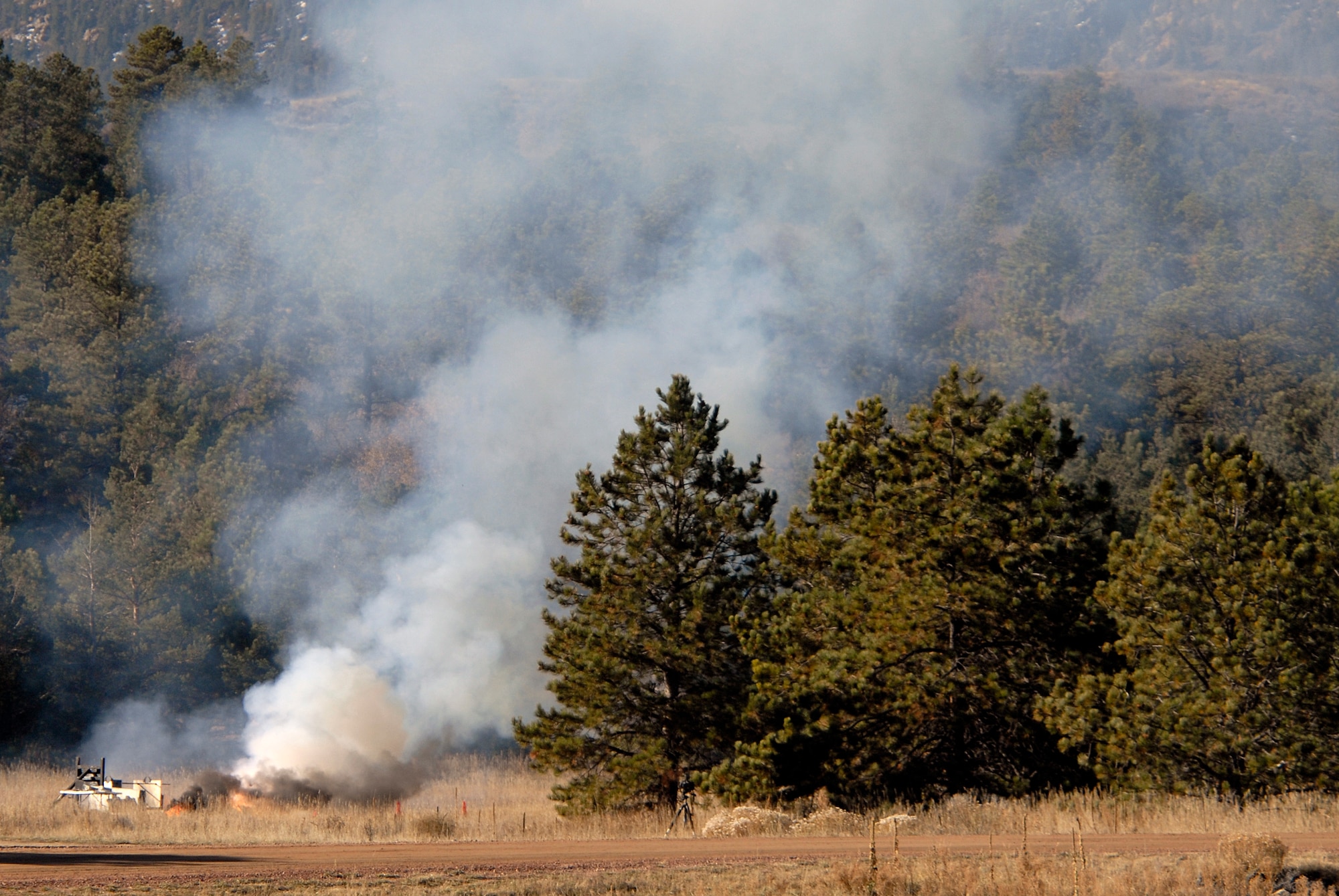 FalconLaunch 6 smolders in Jacks Valley at the U.S. Air Force Academy Nov. 4, 2009, after a malfunction caused the rocket to explode during a test firing. Cadets with the FalconLaunch program will investigate to determine the cause of the malfunction. (U.S. Air Force photo/Mike Kaplan)