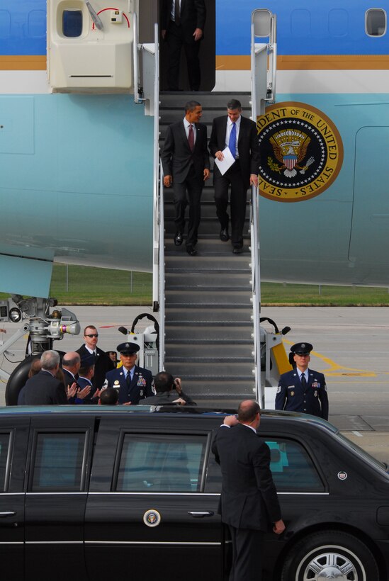 President Barack Obama (left) descends down the stairs out of Air Force One with Secretary of Education, Arne Duncan at the 115th Fighter Wing in Madison Wis., Nov. 4, 2009.  The President visited the Air National Guard base on his way to give a speech at Madison’s James Wright middle school about education reform.  President Obama's visit marks the first time that a sitting president has visited the base. (U.S. Air Force Photo by Master Sgt. Dan Richardson)
