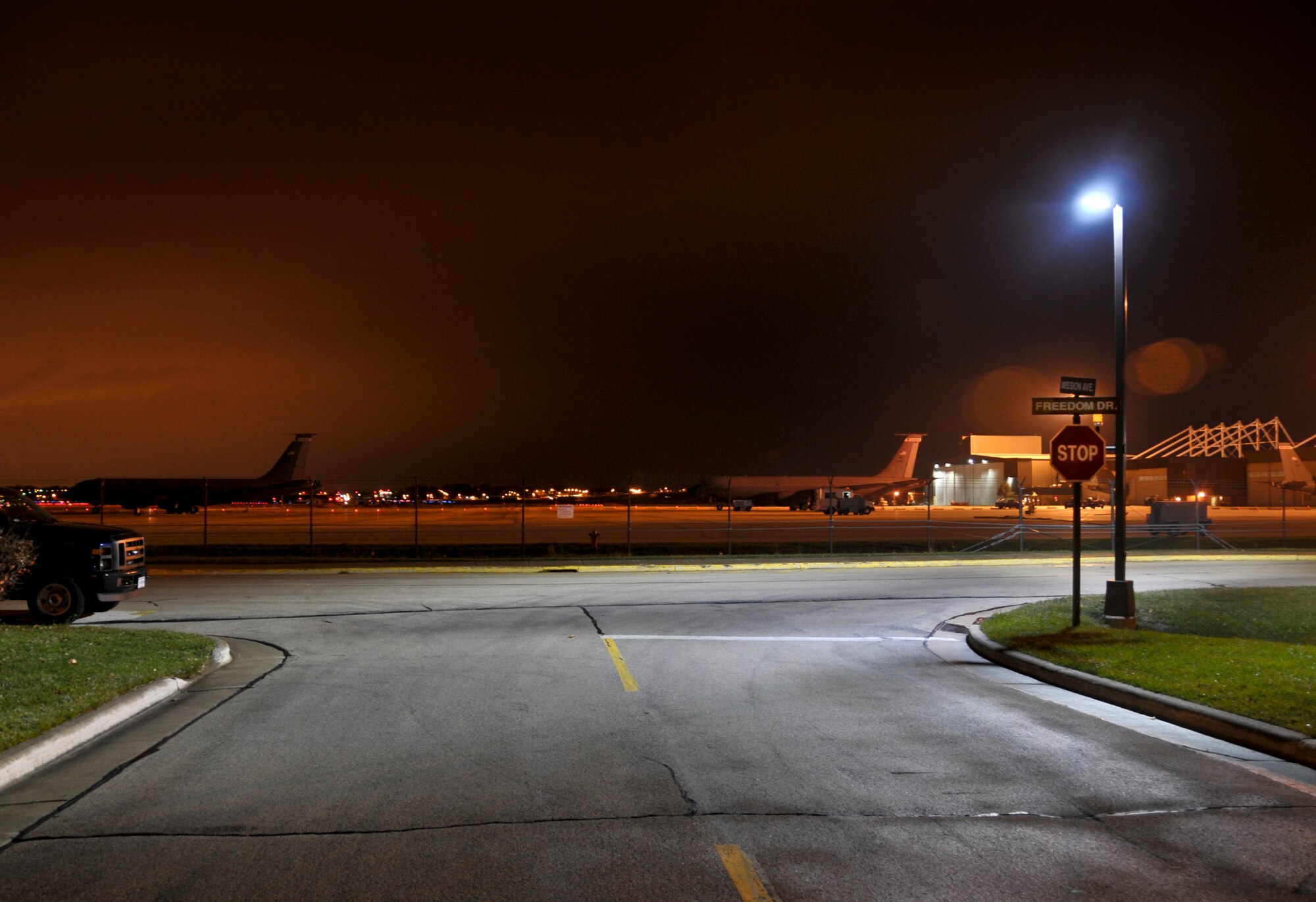 The corner of Freedom and Mission Ave at the 128th Air Refueling Wing, Wisconsin Air National Guard is illuminated by new LED street lights 4 Nov, 2009. The Wing is improving its energy efficiency by replacing older, less efficient street lights with new high efficient Light-Emitting Diode (LED) lights. (USAF Photo by SMSGT Jeffrey Rohloff-released)