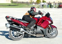 Bill James demonstrates riding techniques during the Sport Bike Safety Course on Lackland's Training Annex Oct. 30. Mr. James is with the 37th Training Wing Safety Office. (U.S. Air Force photo/Alan Boedeker)